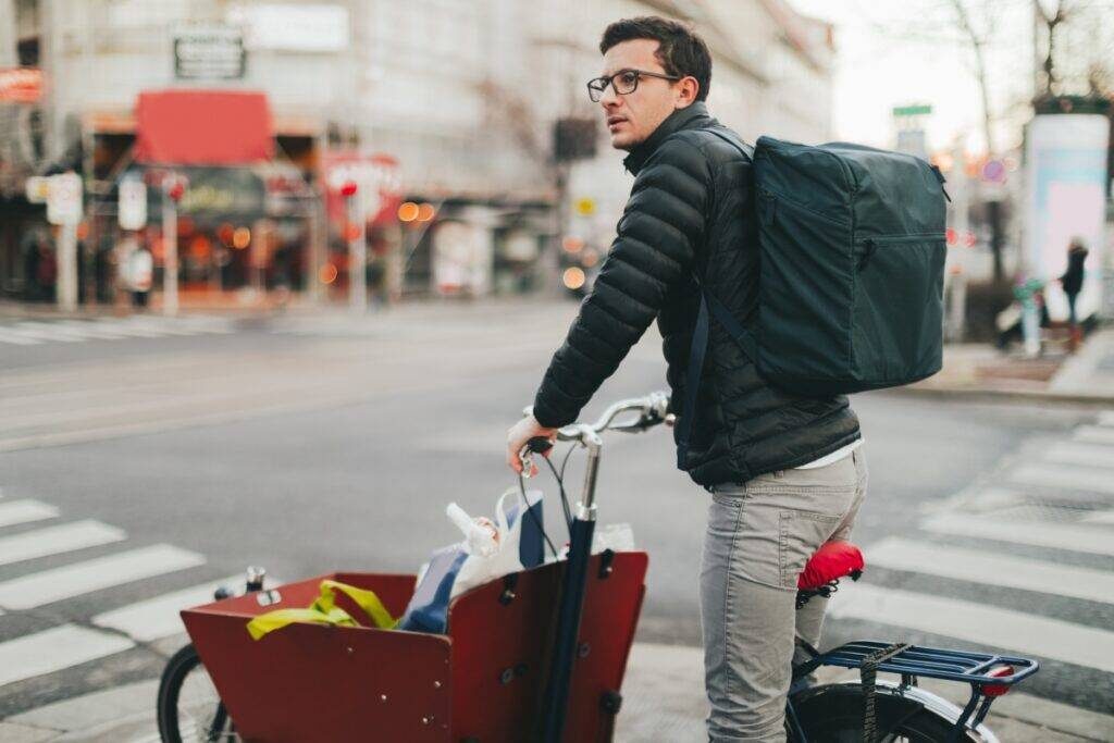 man with cargo bike filled with groceries