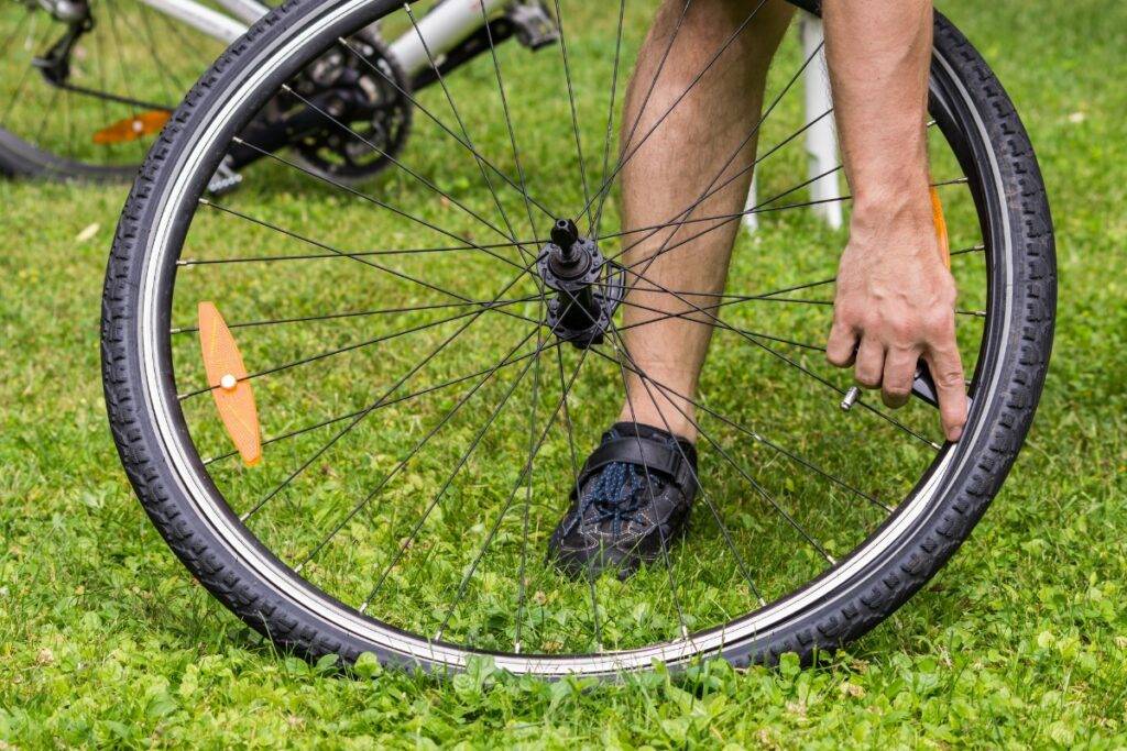 Man removing flat tire