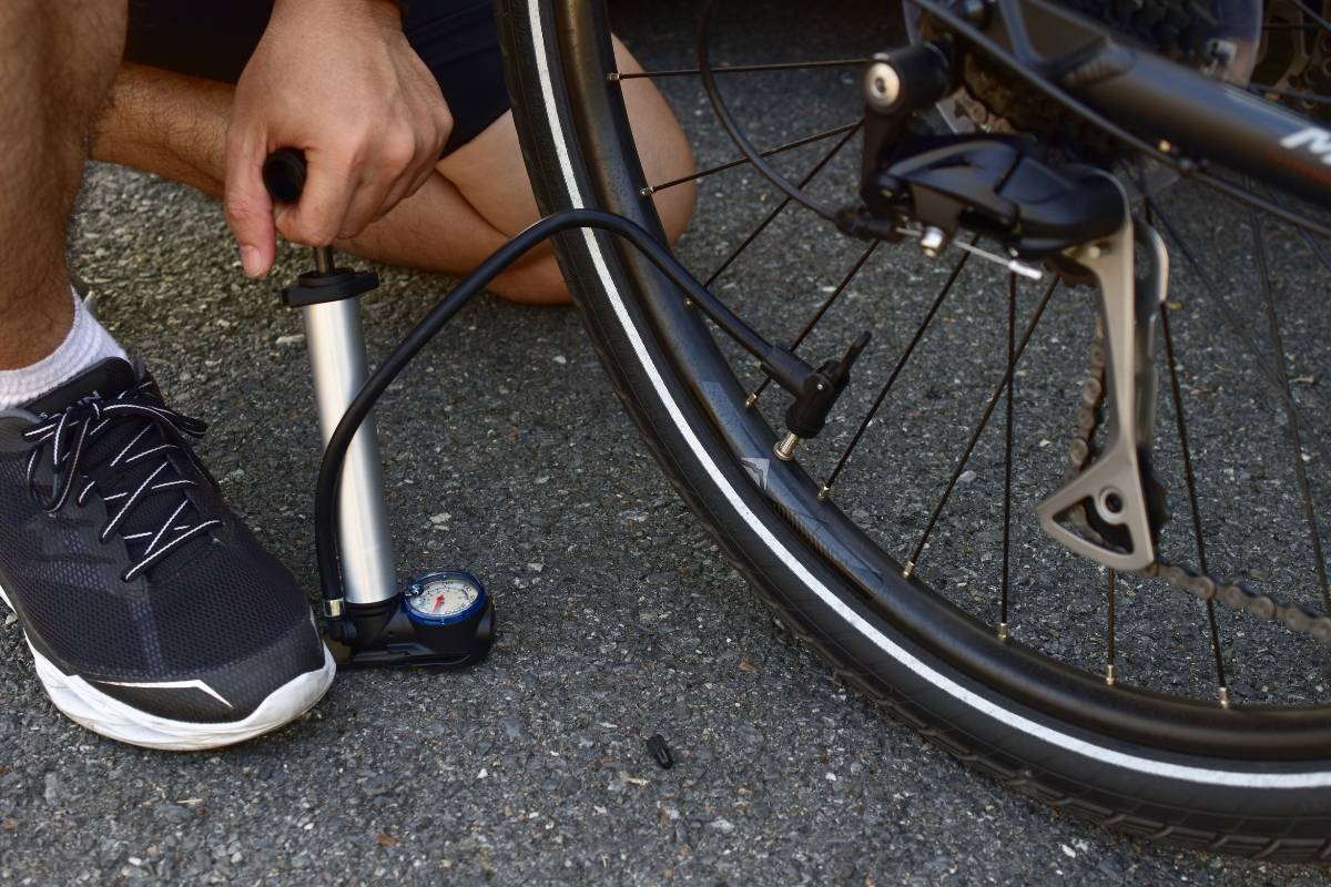 Man inflating a flat tire